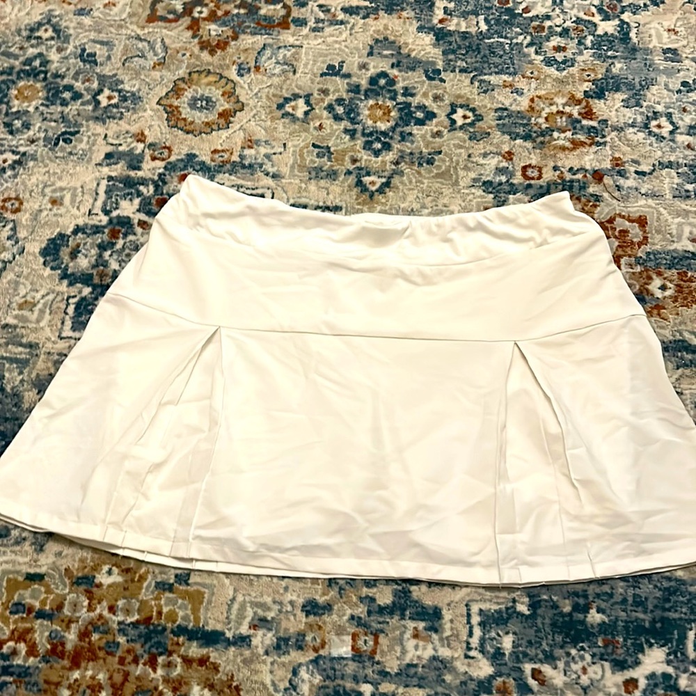 A white golf skirt with shorts built in.